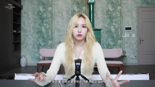Blonde Woman Wearing Headphones And Microphone Says Yes I Am Mina GIF
