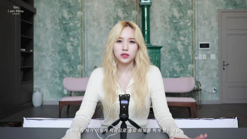 Blonde Woman Wearing Headphones Says Yes I Am Mina GIF