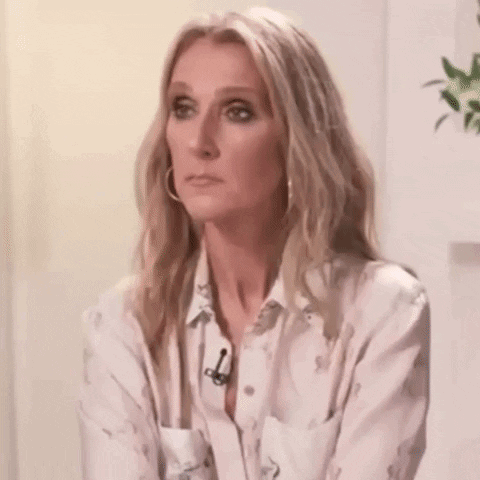Blonde Woman White Shirt Earrings Making Funny Face GIF