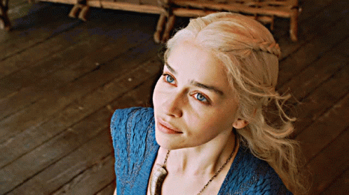 Blonde Woman with Blue Eyes in Blue Top