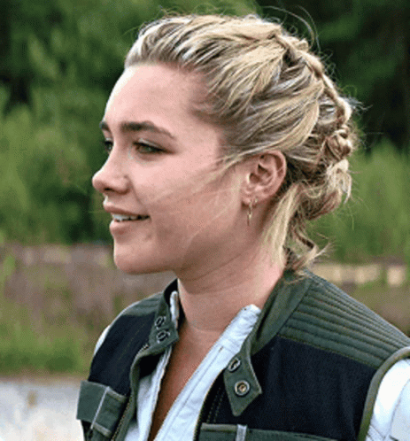 Blonde Woman With Braided Bun And Earrings GIF