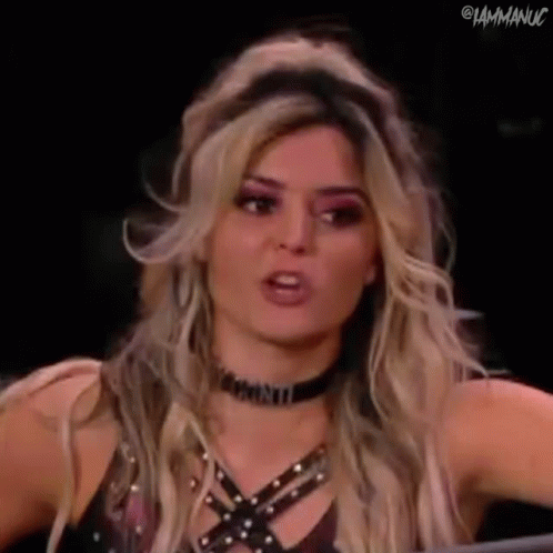 Blonde Woman With Choker Making Funny Face in Ring