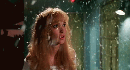Blonde Woman With Feathers Falling on Head