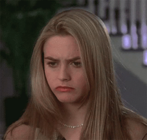 Blonde Woman With Pearl Necklace Making Funny Face