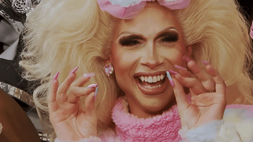 Blonde Woman with Pink Sweater and Nails