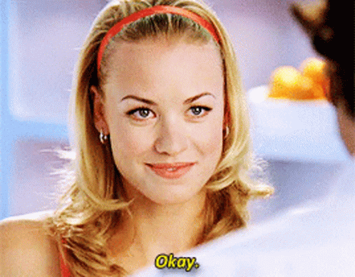 Blonde Woman With Red Headband Saying Okay