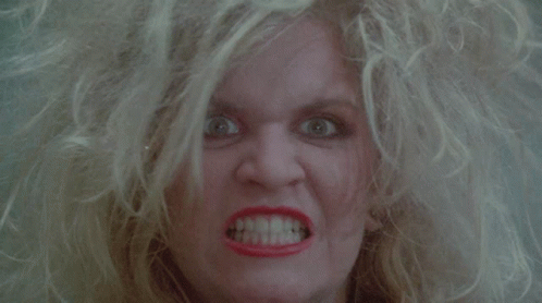 Blonde Woman With Red Lipstick Making Angry Face GIF