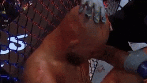 Bloodied Boxer Wiped with Towel in Ring