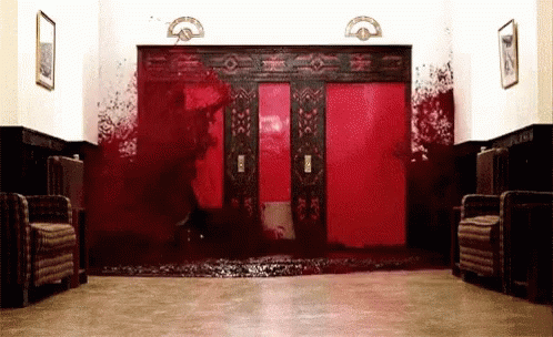 Bloody Hallway With Red Elevator And Chairs GIF