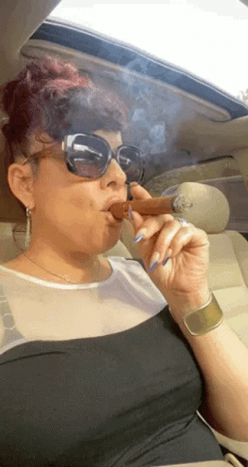 Blowing And Smoking Cigar Lady GIF