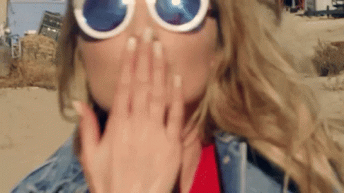 Girl In Shades Blowing Kiss GIF