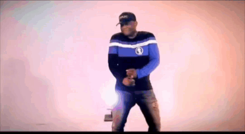 Blue and Black Shirt and Hat Man Dancing