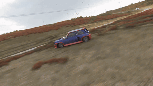 Blue and Red Car on Dirt Road