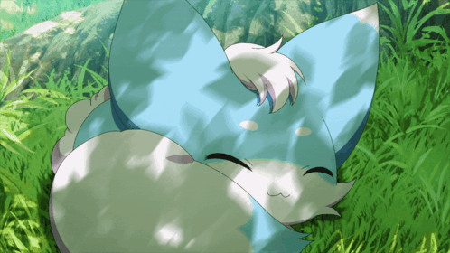 Blue and White Animal Lying in Grass