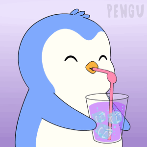 Blue and White Penguin Drinking Glass With Ice Cubes