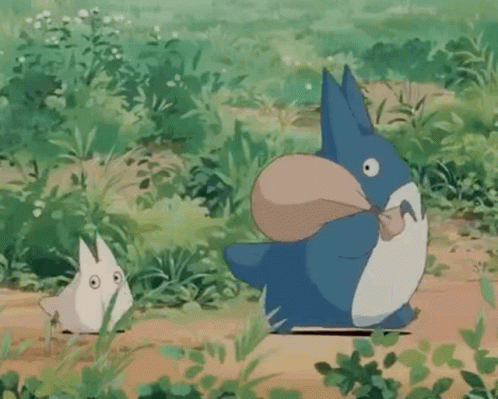 Blue and White Totoro Holding Bag in Mouth with Smaller Totoro