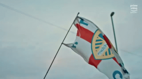 Blue And Yellow Leeds United Logo With Arms Crossed GIF