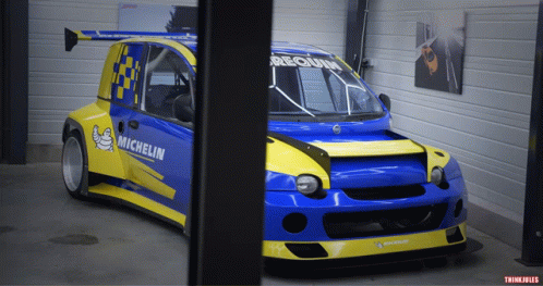 Blue and Yellow Race Car With Michelin