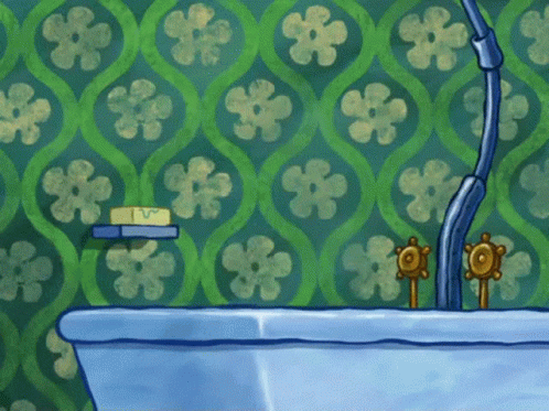 Blue Bathtub in Front of Wall With Green Flowers