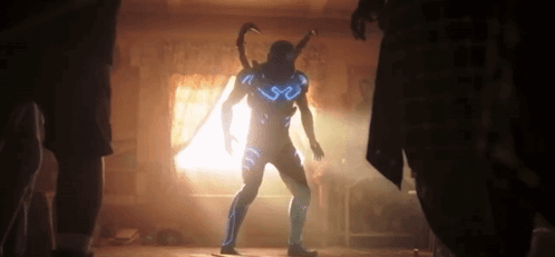 Blue Beetle Look To His Friends GIF