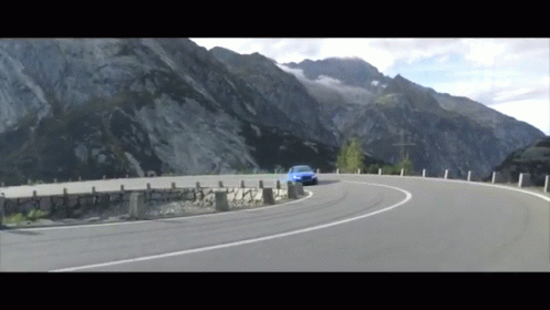Blue Car Driving Mountain Road