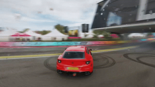 Blue Car Driving on Track with Smoke
