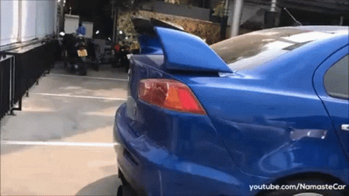 Blue Car Parked with youtube.com/namastecar