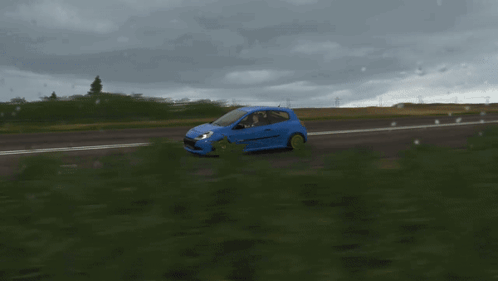 Blue Car With Yellow Wheels Driving