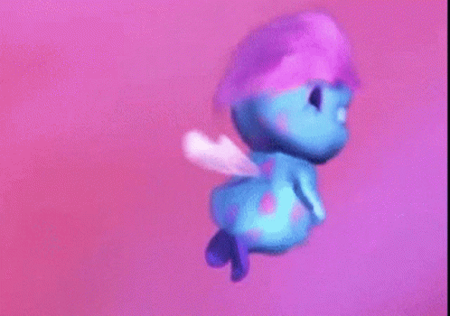 Blue Cartoon Character Flying With Purple Hat And Wings GIF