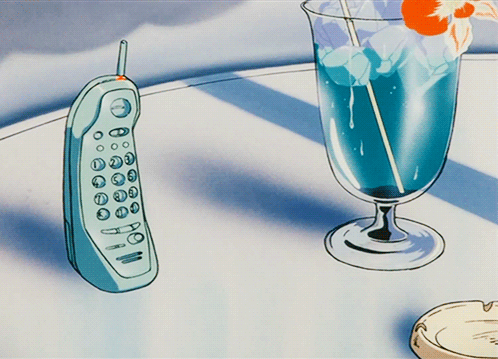 Blue Cell Phone Next To Glass Of Blue Liquid GIF