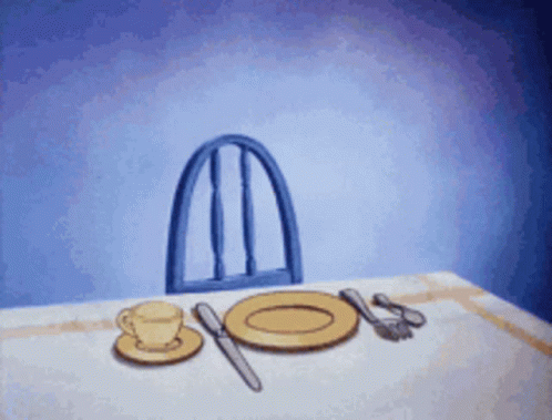 Blue Chair on Table with Plates and Utensils