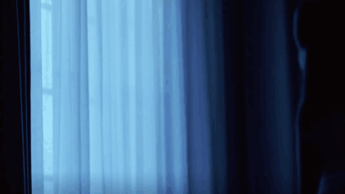 Blue Curtain With Light Through Window