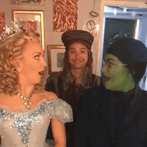 Blue Dress Woman Hat Man Green Mask Woman GIF