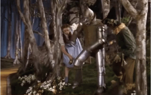 Blue Dress Woman with Armored Man and Scarecrow