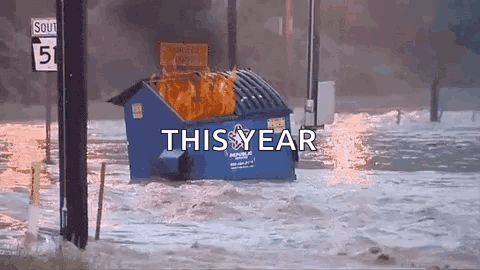 Blue Dumpster on Fire in Flooded Area With This Year