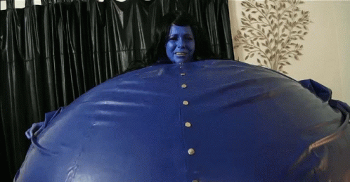 Blue-Faced Woman in Blue Jacket