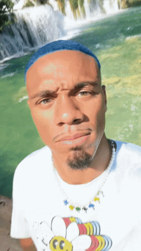 Blue Hair Man Rizz Meme Showing Waterfalls GIF