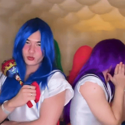 Blue Hair Woman Holding Lollipop With Purple Hair Woman GIF