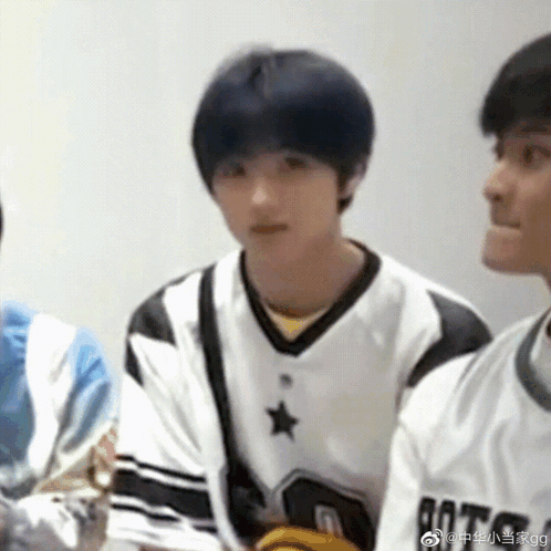 Blue-Haired Boy in White and Black Star Jersey