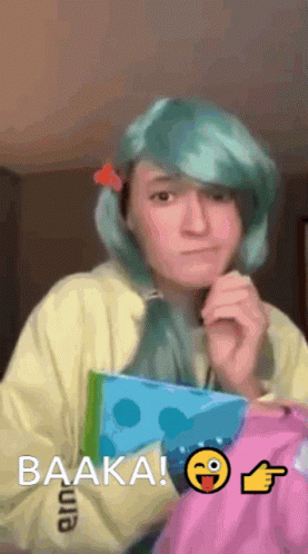 Blue-Haired Girl Holding Book Saying Baaka