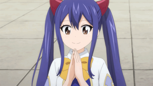 Blue Haired Girl Red Ears Smiling Hands Folded