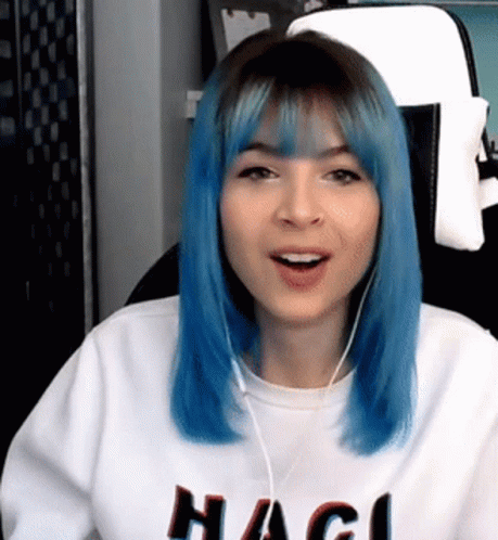 Blue-Haired Woman With Headphones and Hagi Sweater
