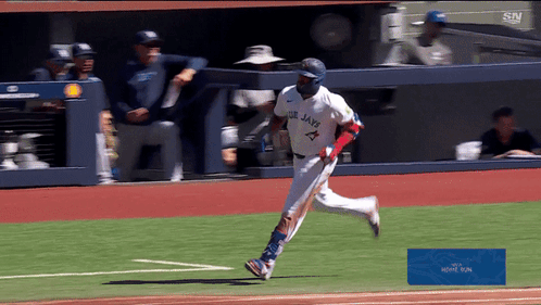 Blue Jays Baseball Player Running on Field