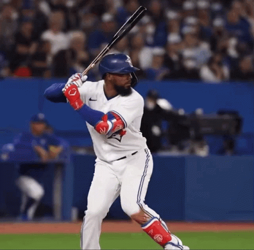 Blue Jays Baseball Player Swinging Bat