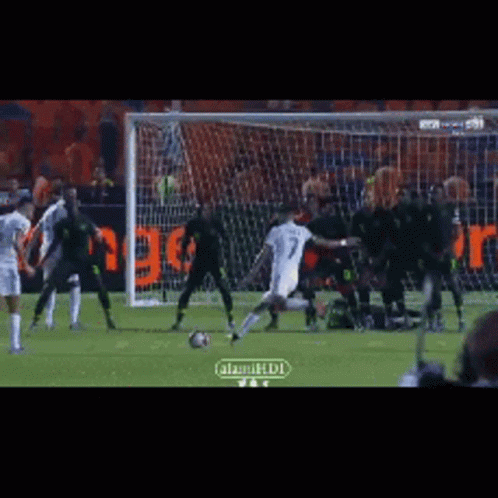 Blue Jersey #16 Soccer Player Diving Into Goal