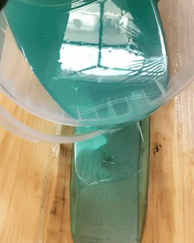 Blue Liquid Water Pouring On Wood GIF