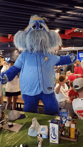 Blue Mascot in Front of Calcium Box