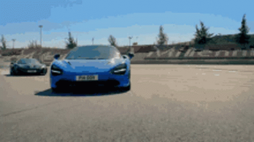 Blue Mclaren Overtaking GIF
