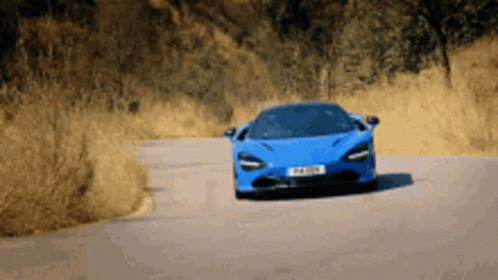 Blue Mclaren Supercar Accelerating GIF