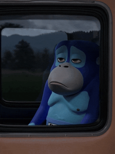 Blue Monkey with Ron Sign in Car